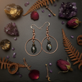 Copper hoop obsidian earrings moody altar flat lay