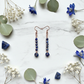 Copper stacked lapis lazuli earrings white marble flat lay