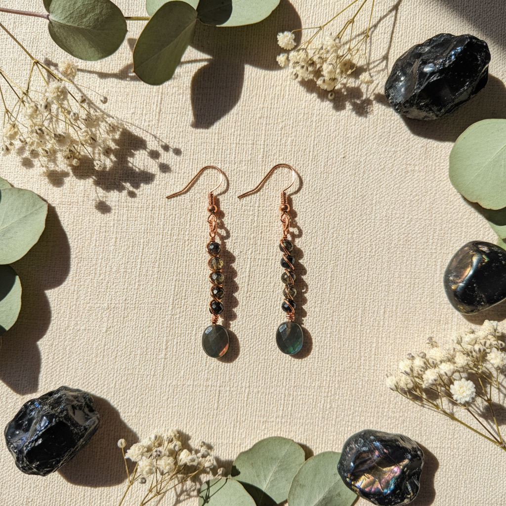 Copper stacked obsidian earrings cream linen flat lay