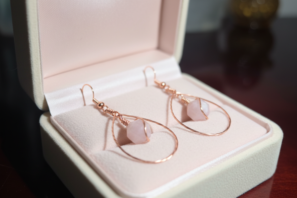 Madagascar Rose Quartz copper teardrop earrings in cream velvet jewelry box